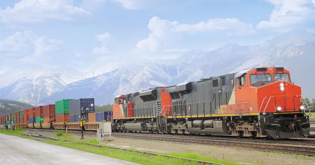 A freight train in the Canadian Rockies pulls intermodal containers.